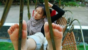 asian girl bare feet swing relaxed swing